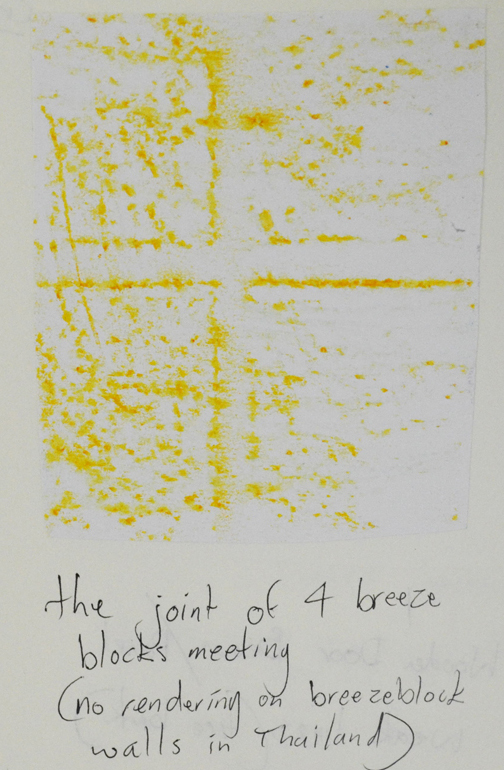 Yellow crayon on breeze block wall